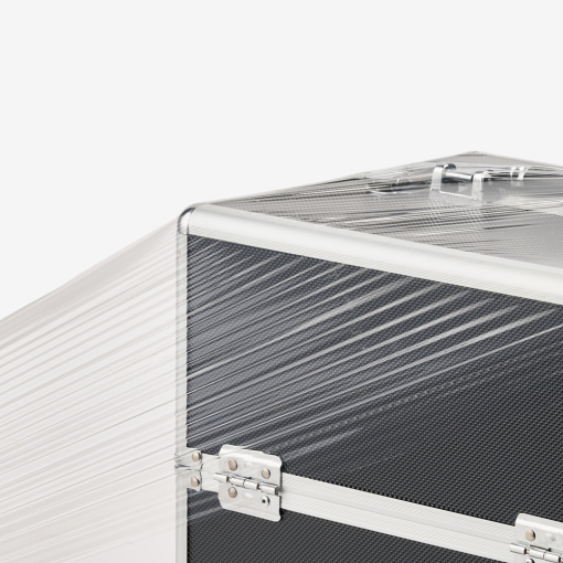 Transparente Stretchfolie – auf ein Produkt (großer Koffer) aufgezogen. Trotz Spannung an der Ecke reißt die Folie nicht